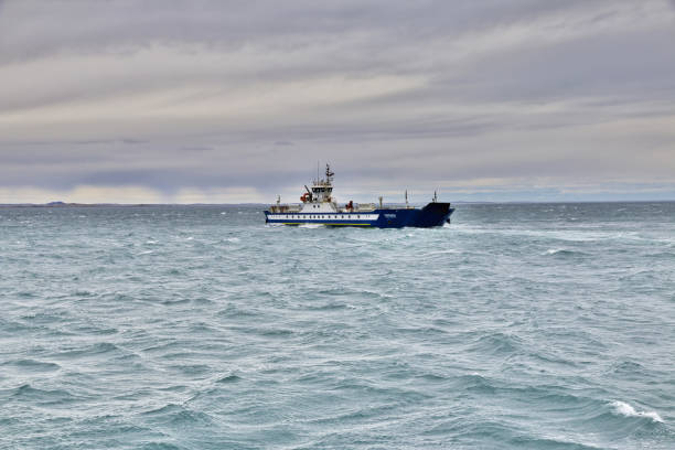 The ferry on Magellanic Strait, Tierra del Fuego, Chile Magellanic Strait, Chile - 21 Dec 2019: The ferry on Magellanic Strait, Tierra del Fuego, Chile chile argentina punta arenas magellan penguin stock pictures, royalty-free photos & images