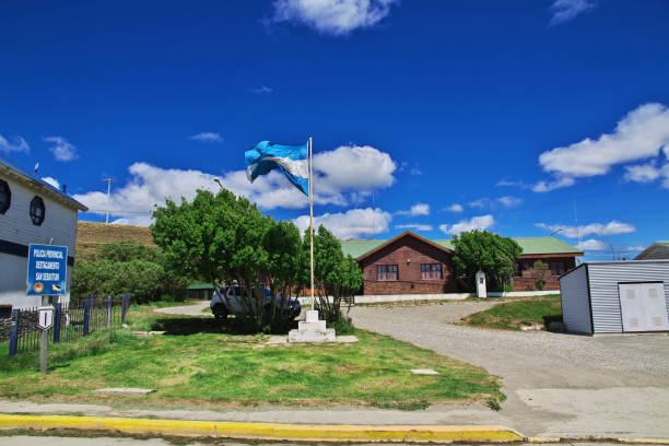 The flag on the border between Argentina and Chile in Tierra del Fuego Tierra del Fuego, Argentina - 21 Dec 2019: The flag on the border between Argentina and Chile in Tierra del Fuego chile argentina punta arenas magellan penguin stock pictures, royalty-free photos & images