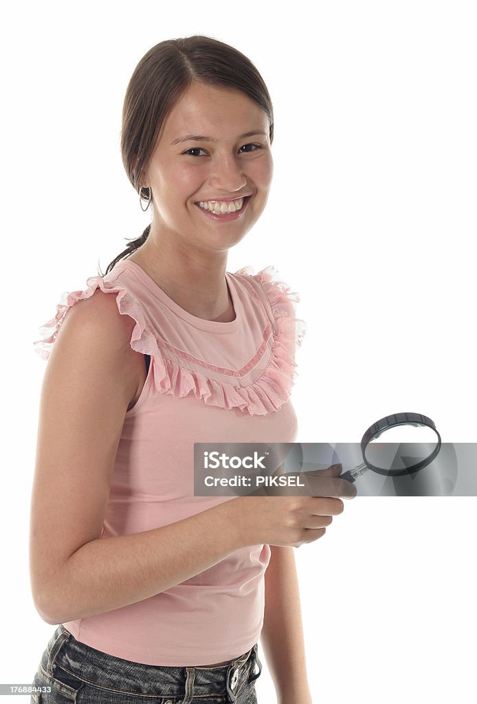 Mujer agarrando lupa - Foto de stock de Adolescente libre de derechos