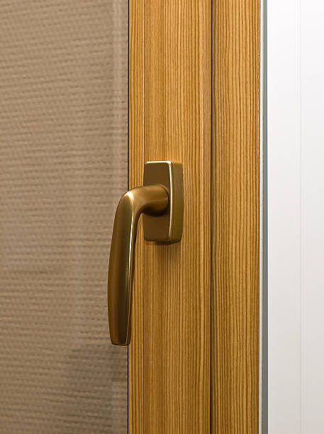 istock Window handle on fiberglass frame. Gold color. 176884683