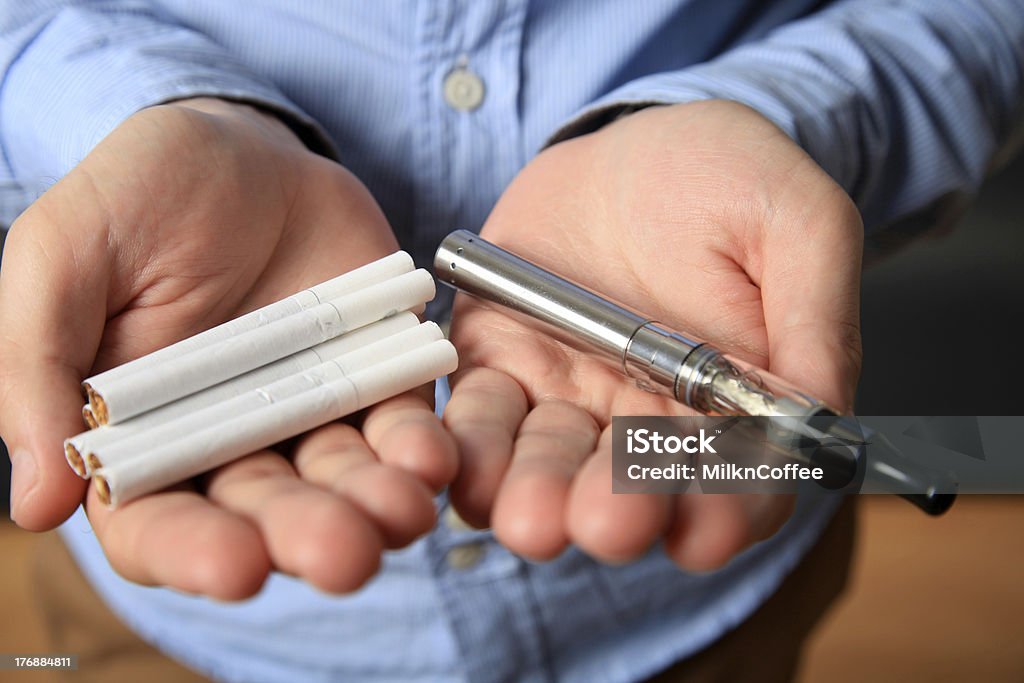 Choice between cigarette and e-cigarette Cigarette Stock Photo