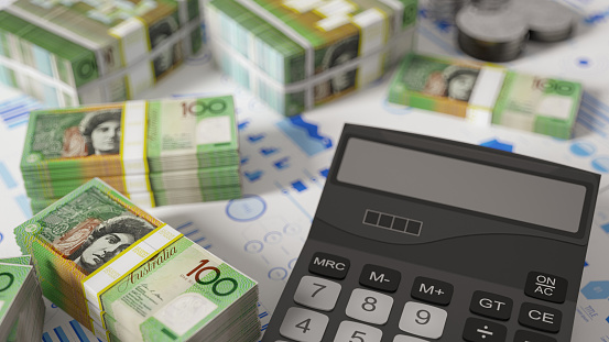 Australian Dollar Stack with a Calculator and Financial Reports. 3D Render