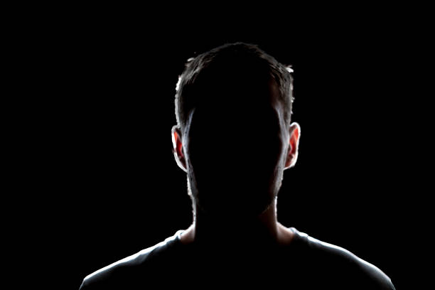 istock dark backlight shadow silhouette of male person, incognito unknown profile 1768858018