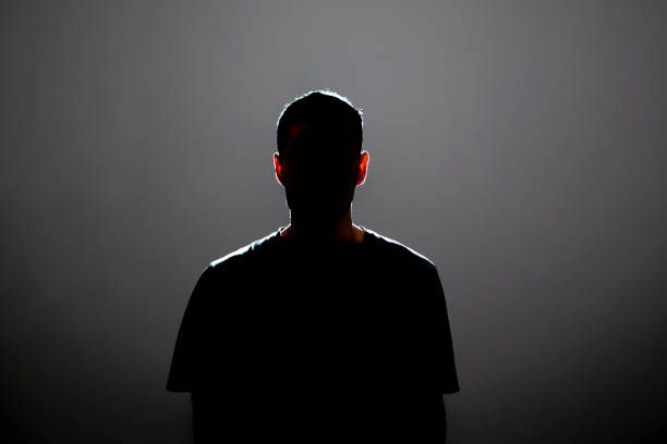 istock dark backlight shadow silhouette of male person, incognito unknown profile 1768858025
