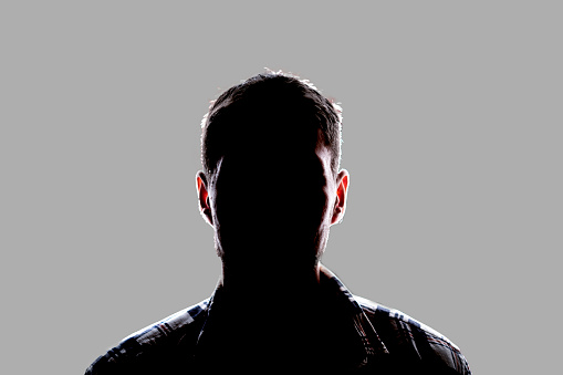 dark backlight shadow silhouette of male person, incognito unknown profile