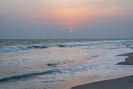Photo of the sun setting on the beach in Lagos Nigeria