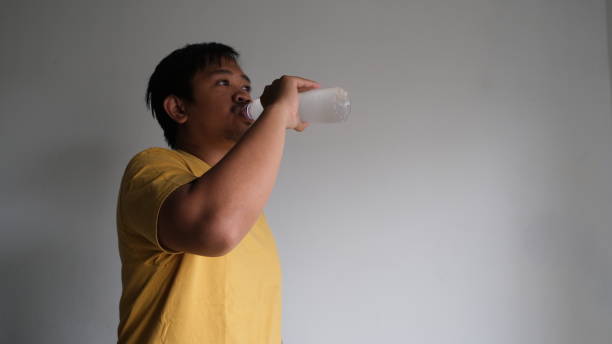 istock Southeast Asian man drinking cold water from plastic bottle 1768865211