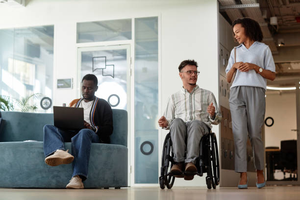 istock Business people walking through the office corridor 1768866277