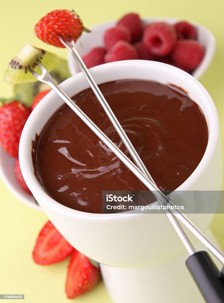 Chocolate fondue with assorted fruits gourmet chocolate fondue with strawberry and kiwi Banana Stock Photo