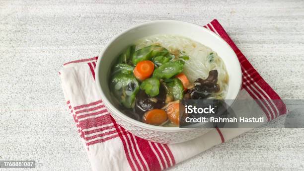 Clear Soup Of Carrot Vermicelli And Gambas Or Clear Soup Of Carrot Vermicelli And Luffa Vegetables Serve In White Ceramics Bowl Selective Focus Stock Photo - Download Image Now