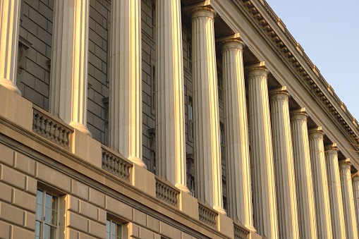 Front facade and columns of the IRS building in Washington DC.  Sunset with polarizing filter.  Sunlight is just hitting the outer edges of the scallops in the column structure for a very interesting effect.  - See lightbox for more
