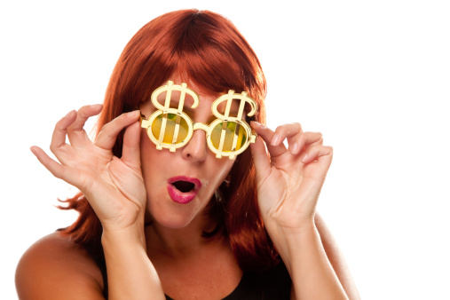 Red Haired Girl with Bling-Bling Dollar Glasses Isolated on a White Background.