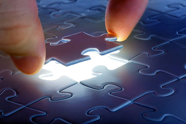 istock One puzzle piece over empty glowing spot in puzzle 176888811