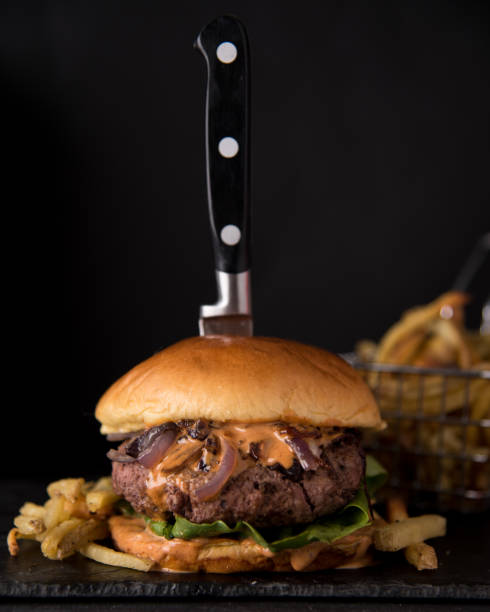 istock Luxury hamburger with fresh salad and chipotle sauce 1768891179