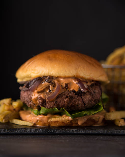 istock Luxury hamburger with fresh salad and chipotle sauce 1768892237
