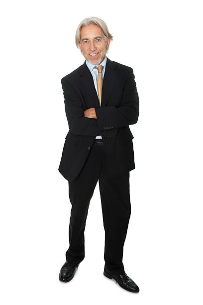 istock Mature businessman standing on white background 176889240