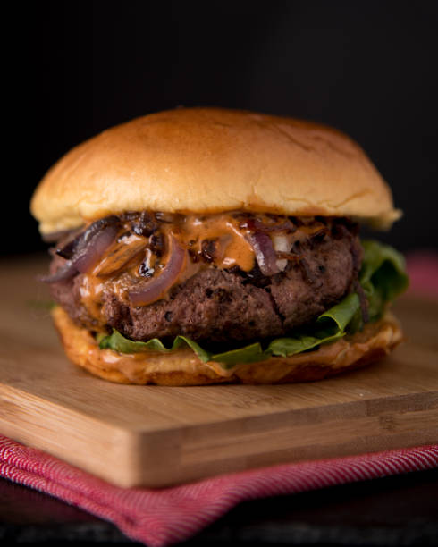 istock Luxury hamburger with fresh salad and chipotle sauce 1768894970