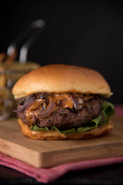 istock Luxury hamburger with fresh salad and chipotle sauce 1768894978