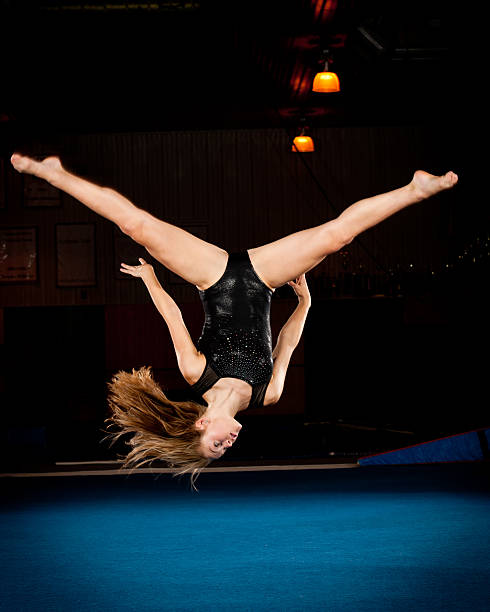 istock Gymnast spots her landing while upside down in mid-air 176889713