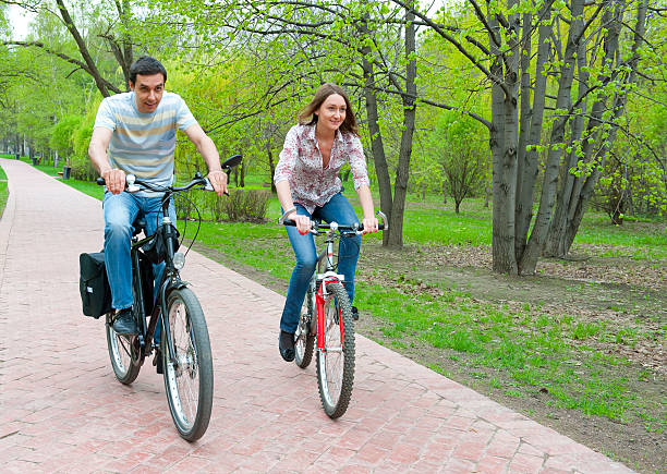 istock Happy young couple riding bicycles 176890103