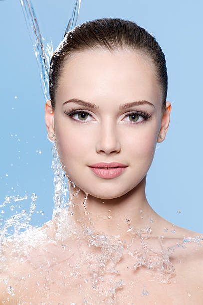istock Health beautiful girl with falling water 176890433