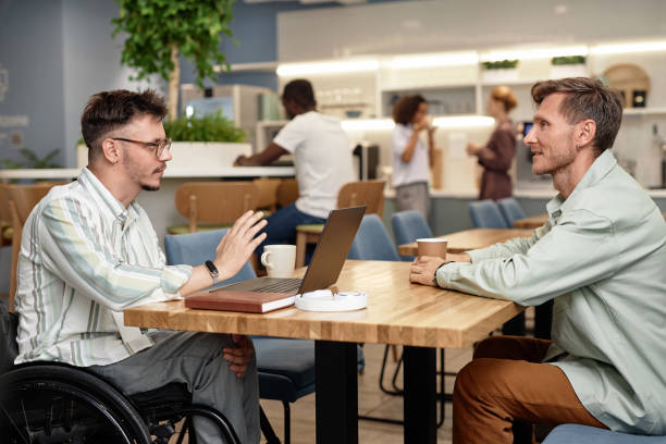 istock Businessmen discussing presentation at meeting 1768905956