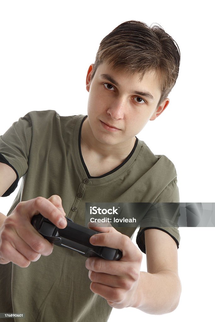 Подростковой мальчик играет видеоигра - Стоковые фото Brand Name Video Game роялти-фри