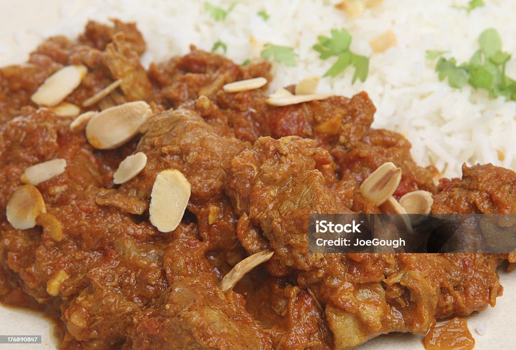 Lamb Rogan Josh Indian Curry Lamb Rogan Josh Indian curry with pilau rice Almond Stock Photo