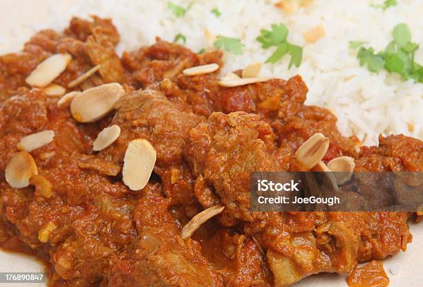 Lamb Rogan Josh Indian Curry Stock Photo - Download Image Now - Almond, Basmati Rice, Cilantro