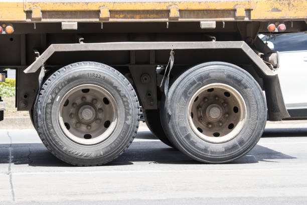 Mud is bouncing around the tire and it is dirty.