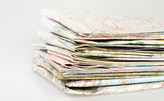 stack of paper maps