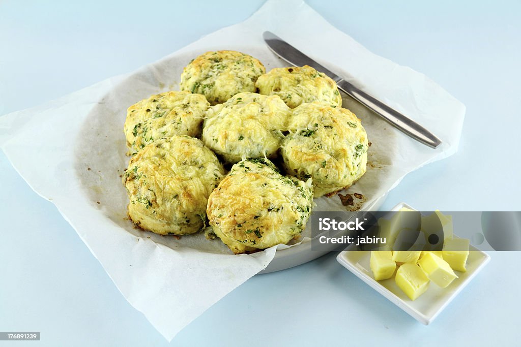 Cheese And Spinach Scones Delicious fresh baked savory cheese and spinach scones ready to serve. Baked Stock Photo