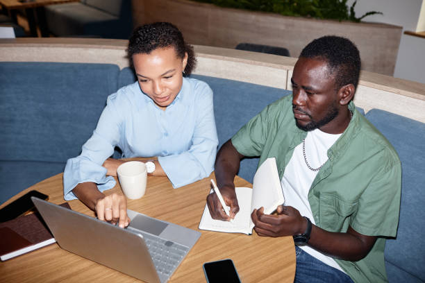 istock Colleagues discussing online presentation in team 1768913032