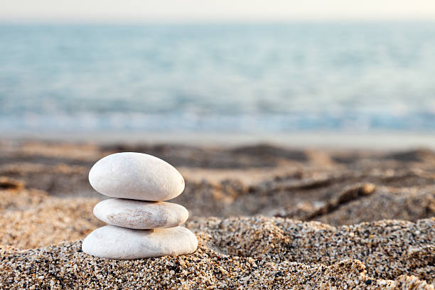 istock Stack or pile of balancing stones on sea beach 176891647