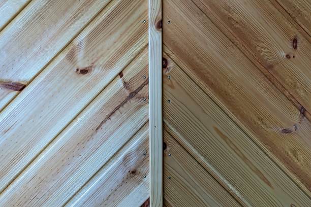 istock The door is lined with light wood. Decoration style - herringbone. 1768917349