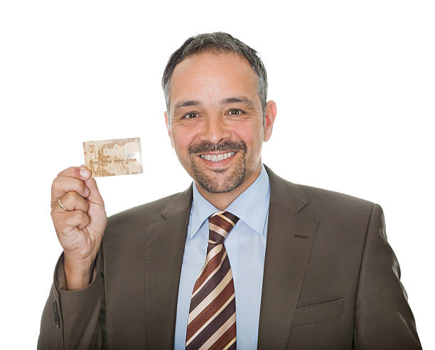 istock Mature businessman showing a credit card 176891804