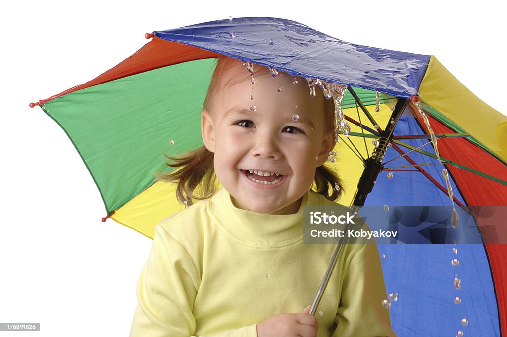 Cute child catching raindrops under umbrella "Cute cheerful child with colorful umbrella is catching raindrops, isolated over white" Child Stock Photo