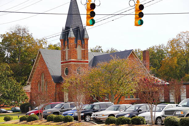 Small Town Brick Church with Full Parking Lot stock photo