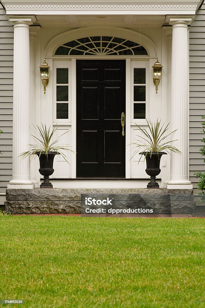 Upscale Home Front Entrance Front yard and entrance to an upscale home. Vertical shot. Front Yard Stock Photo