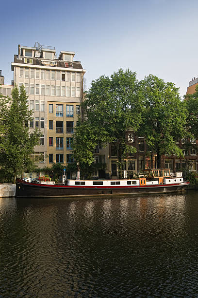 istock Amsterdam canals and typical houses on a blue sunny day 176892556