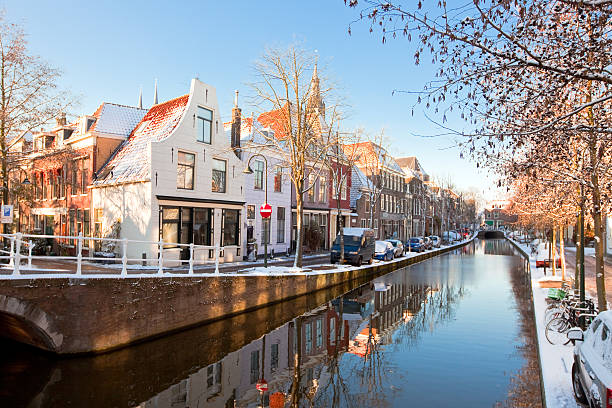 Delft residential district Houses and Canal in Delft residential district. horizontal shot delft winter netherlands snow stock pictures, royalty-free photos & images