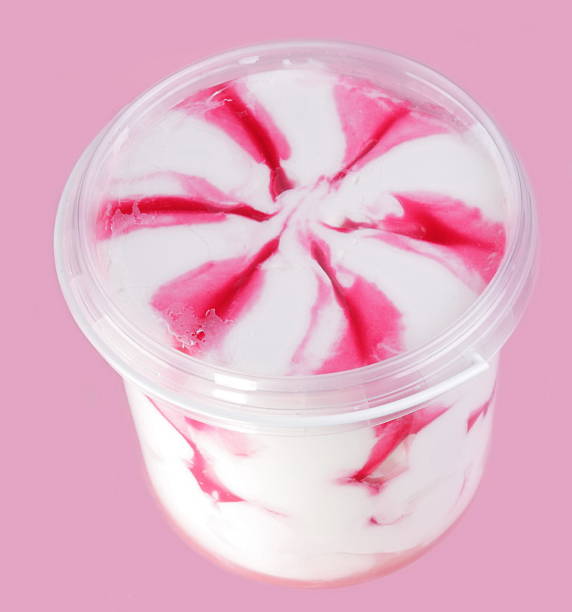 pot of ice cream on pink stock photo