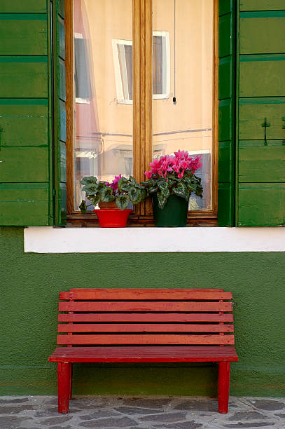 Window and Bench outside house in Burano, Venice stock photo