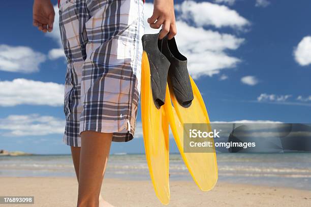 Teenage Boy On Beach With Flippers Stock Photo - Download Image Now - 12-13 Years, Beach, Beach Holiday