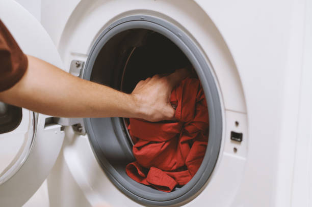 istock Taking Shirts out of Washing Machine 1768933398