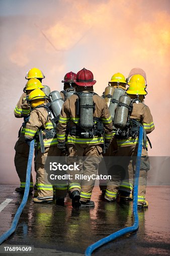 istock Fire training exercise with blue hoses 176894069