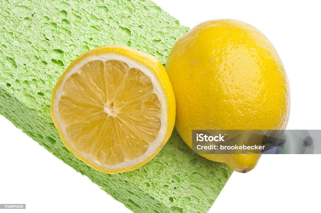 Natural Lemon Clean Lemons are a Natural Environmentally Friendly Way to Clean Your Home.  File is Isolated on White with a Clipping Path. Cleaning Sponge Stock Photo