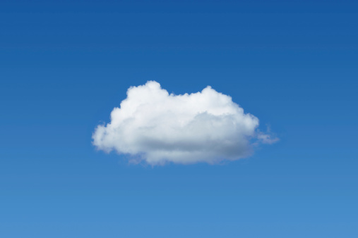 Una nube en el cielo azul photo