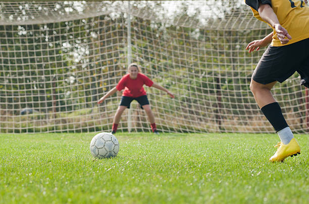 soccer Defending teen goalie stock pictures, royalty-free photos & images