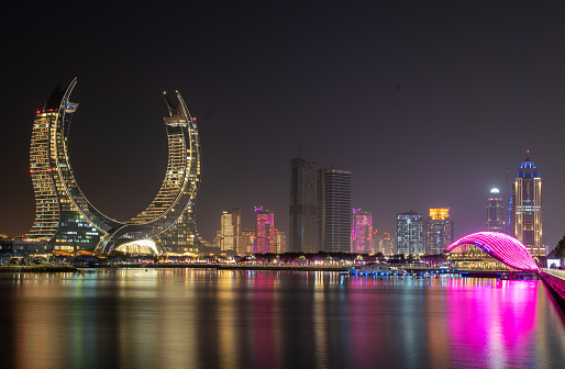 Lusail, Qatar- December 12,2022: the newly developed lusail city with winter wonderland and crescent tower in the background.